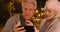 Confused elderly couple lost in a different country and uses smartphone for help