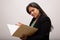 Confused Hispanic Businesswoman Looks Through Folder