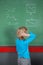 Confused Little Boy Looking At Board