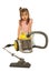 Confused little girl with vacuum cleaner