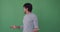 Confused man over green background