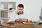 confused overweight businessman choosing donuts or hamburger with french