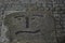 Confused smiley face carved in stone