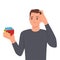 Confused young man playing rubik\\\'s cube. Scratching his head
