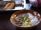 Congee with minced pork and egg in bowl