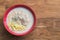 Congee, Rice porridge, Rice gruel, Rice soup on wooden background, Top view