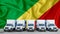 Congo flag in the background. Five new white trucks are parked in the parking lot. Truck, transport, freight transport. Freight