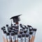 Congratulations graduates background, inscription in pencil and graduate cap