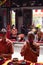 The congregation and the visitors have a prostration while praying in the temple