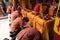 The congregation and the visitors have a prostration while praying in the temple