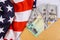 Congressional lawmakers are putting the finishing touches on a stimulus bill USA dollar cash banknote on American flag Global