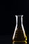 Conical flask filled with yellow chemical - Series 4