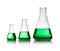 Conical flasks with green liquid on white