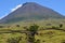 The conical Pico volcano looming over its namesake island Azores archipelago, Portugal