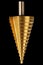 Conical step drill for drilling holes of different diameters, isolated on black background