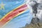 conical volcano blast eruption at day time with white smoke on Democratic Republic of Congo flag background, problems of disaster