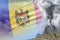 Conical volcano blast eruption at day time with white smoke on Moldova flag background, troubles because of natural disaster and