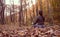 Connect with mothernature and breathing fresh air, woman meditating in forest. Busting energy