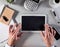 Connected businessman hands working on digital tablet, flat lay