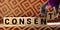 Consent word from wooden blocks on desk