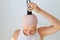 consequences of chemotherapy. Shaving hair on the head with a razor.