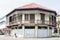 Conserved old mixed concrete and wooden shophouse in downtown Nakhon Phanom, Thailand