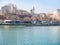 Constanta, Romania - 02.25.2021: View with Tomis Turistic Port and the seafront with outdoor restaurants and Mosque of Constanta-