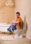 Constipation problem, man sitting on toilet bowl