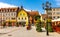 Constitution square Plac Konstutucji with St. John Evangelist church in historic old town center of Bartoszyce in Poland