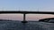 Constructed bridge across the wide ocean bay with shore