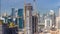 Construction activity in Dubai downtown with cranes and workers timelapse, UAE.