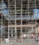 Construction background-scaffolding covering multistory building