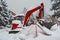 Construction Backhoe Stopped on a Frozen Snow Day