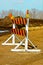 A construction barricade on a gravel road