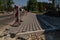 Construction of brick paved sidewalk, half built pavement road