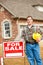 Construction: Builder Stands By Sale Sign