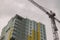 Construction building process crane high object moody weather urban photography foreshortening from below