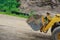 Construction bulldozer soil digging ground landscaping works on the earthmoving