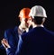 Construction business concept. Technical architect talks to project manager with serious face. Engineers with calm faces