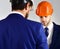 Construction, business people, architecture concept. Businessman and engineer back view.