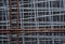 Construction: Close up of galvanised welded steel square mesh and rusty rebar mesh. 2