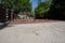 Construction of a cobblestone street. Pile of cobblestones with sand and signage signs, residential block, residential