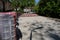 Construction of a cobblestone street. Pile of cobblestones with sand and signage signs, residential block, residential