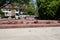 Construction of a cobblestone street. Pile of cobblestones with sand and signage signs, residential block, residential