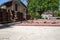 Construction of a cobblestone street. Pile of cobblestones with sand and signage signs, residential block, residential