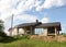 Construction of country modern house. Cottages, townhouses and line suburb houses. Unfinished private home of blocks on a