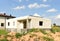 Construction of country modern house. Cottages, townhouses and line suburb houses. Unfinished private home of blocks on a