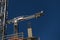Construction crane atop a building being built