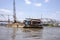 Construction crane on barge along Saigon River in Vietnam