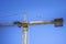 Construction crane. Huge crane against blue sky